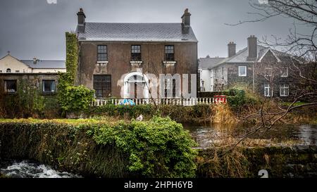 An empty and abandoned house on the banks of a canal near the River Corrib in central Galway in Ireland. Stock Photo