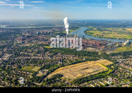 Aerial view, thyssenkrupp Steel Europe - Factory harbour Schwelgern at the river Rhine as well as fallow area and building site Friedrich-Park in Marx Stock Photo