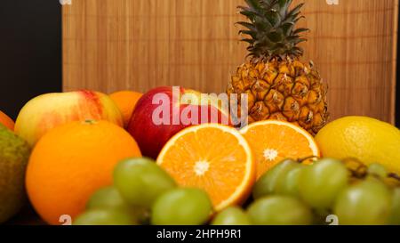 Spring or Summer concept. Many kinds of exotic fruits, can use for summer or food content background. Orange, apple, pineapple Stock Photo