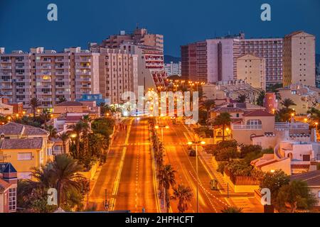 Panoramic night view of Gran via de la Manga avenue, in the tourist resort of La Manga del Mar Menor town, in Murcia province, Spain Stock Photo