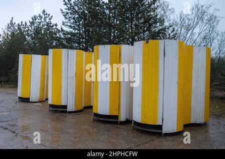 Strand toilets. Yellow movable strand toilets in a row Stock Photo