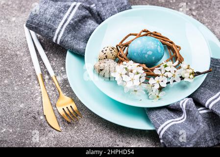 Easter table setting with blue egg Stock Photo