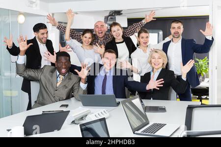 Delighted group of multinational business people in office Stock Photo