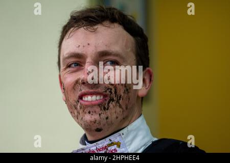 Ascot, Berkshire, UK. 19th February, 2022. A muddy day out on the racetrack for jockeys at Ascot today. Credit: Maureen McLean/Alamy Stock Photo