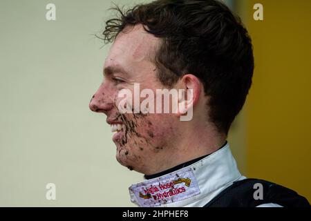 Ascot, Berkshire, UK. 19th February, 2022. A muddy day out on the racetrack for jockeys at Ascot today. Credit: Maureen McLean/Alamy Stock Photo