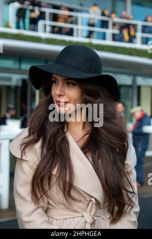 Ascot, Berkshire, UK. 19th February, 2022. Ladies fashion - winter hats and coats at Ascot Racecourse. Credit: Maureen McLean/Alamy Stock Photo