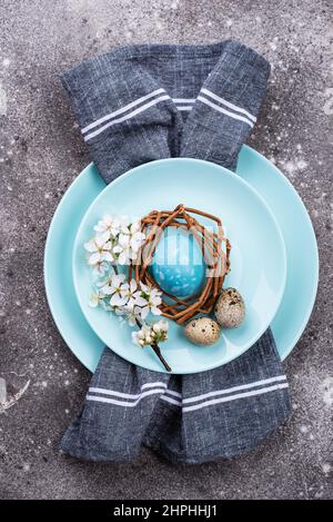 Easter table setting with blue egg Stock Photo