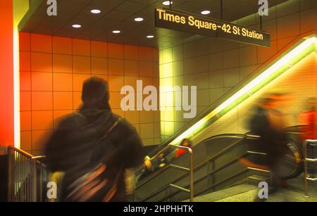 Subway escalator Times Square, New York City Transit System  Underground station interior. Public transportation. People rushing to work. MTA USA Stock Photo