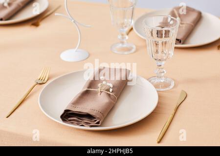 Close up of elegant place setting on dinner table decorated in soft Spring theme, copy space Stock Photo