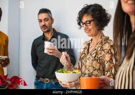 Group of office workers taking a lunch break. Stock Photo