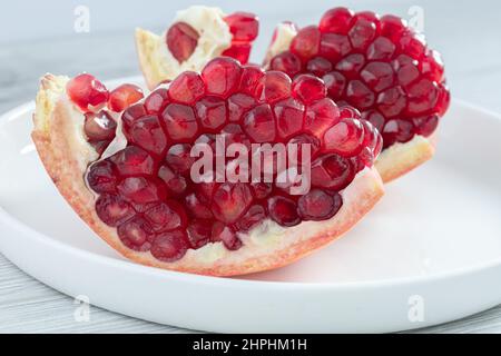 Two pieces of  fresh pomegranate, close-up Stock Photo