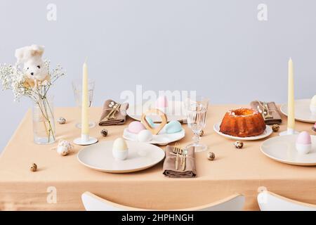 Minimal background image of elegant dinner table decorated for Spring and Easter, copy space Stock Photo