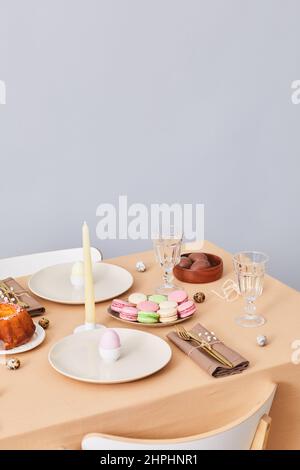 Vertical background image of elegant dinner table decorated for Easter and Spring, copy space Stock Photo