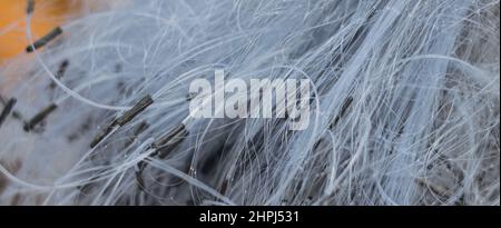 BANNER Abstract real photo white gray pale blue background. Close sail sea fishing tangled line airy mesh texture. Geometric waves circles threads Stock Photo