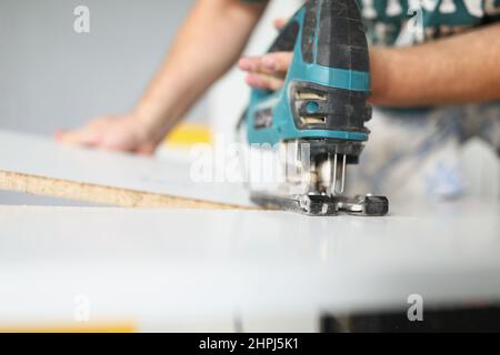Man using tool for work Stock Photo