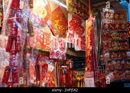 Chinese ornaments hung up in shops at market during Chinese New Year Stock Photo