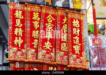 Chinese ornaments hung up in shops at market during Chinese New Year Stock Photo