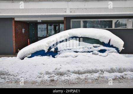 car covered in snow parked on the street, Lappeenranta Finland Stock Photo
