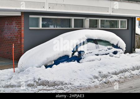 car covered in snow parked on the street, Lappeenranta Finland Stock Photo