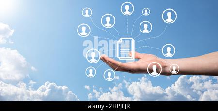 Man hold document and user icon.Corporate data management system DMS and document management system concept. Businessman click or publish on document Stock Photo