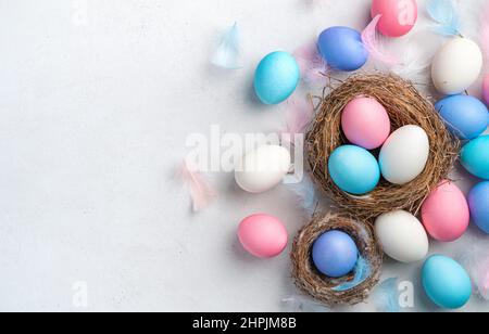 Festive background with Easter eggs on a gray background. Top view. Happy Easter. Stock Photo