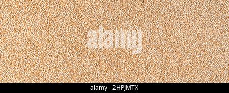 White seeds of useful quinoa. Culinary background. Panorama, horizontal view. Stock Photo