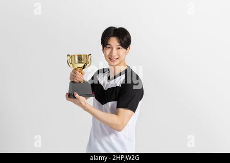 volleyball sports player, asian korean man with trophy Stock Photo