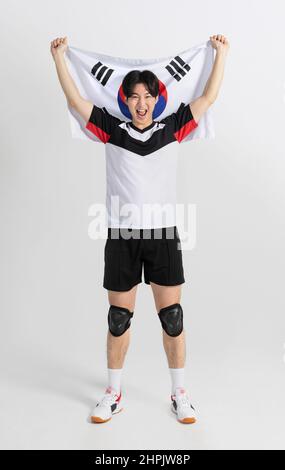 volleyball sports player, asian korean man holding Korean flag Taegeukgi Stock Photo