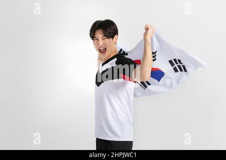 volleyball sports player, asian korean man holding Korean flag Taegeukgi Stock Photo