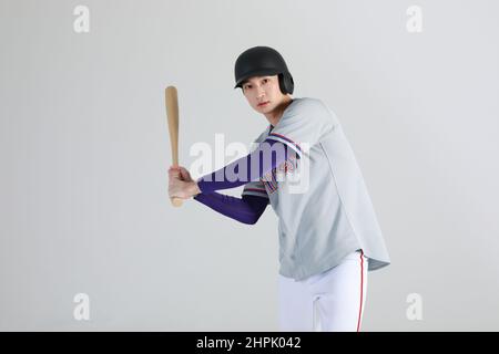 baseball sports player, asian korean man with bat Stock Photo