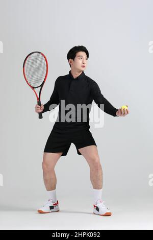 tennis sports player, asian korean man with racket, studio Stock Photo