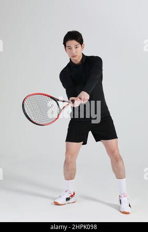 tennis sports player, asian korean man with racket, studio Stock Photo