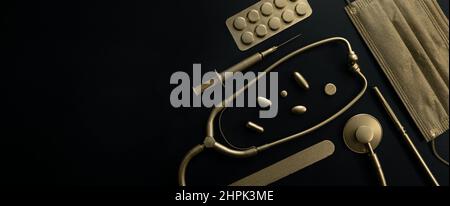 premium luxury healthcare and medicine concept - golden medical items on black background with copy space Stock Photo