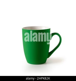 Green empty coffee or tea cup isolated on a white background. Patrick day celebration. Stock Photo