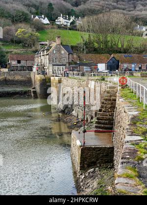 The quay and harbour entrance at Porlock Weir on the Exmoor coast of Somerset UK Stock Photo