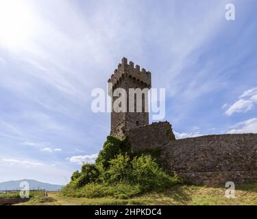 Spindrift clouds over the ancient ruins of the brick walls of Rocca of Radivcofani in Tuscany, Italy Stock Photo