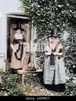 Machine Colorized Welsh Woman with Spinning Wheel from the book ' The living races of mankind ' a popular illustrated account of the customs, habits, pursuits, feasts & ceremonies of the races of mankind throughout the world by Sir Harry Hamilton Johnston, and Henry Neville Hutchinson Volume 2 Published in London by Hutchinson & Co. in 1902 Stock Photo