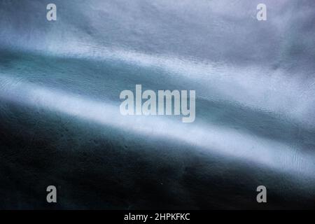Olive green genuine cow luxury leather texture deep green background Stock Photo