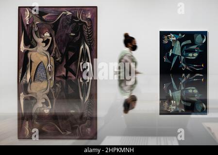London, UK. 22nd Feb, 2022. (L) 'Belial, Emperor of the Flies', 1948, by Wilfredo Lam and 'The Pi Bird's Night Flight', 1952, by Eugenio Granell. Preview of “Surrealism Beyond Borders”, a new exhibition at Tate Modern that shows how Surrealism inspired and united artists around the globe based on extensive research undertaken by Tate and The Metropolitan Museum of Art in New York. The works span 80 years and 50 countries and will be on display 24 February to 29 August 2022. Credit: Stephen Chung/Alamy Live News Stock Photo