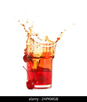 Glass of tasty Manhattan cocktail with splashes isolated on white background Stock Photo