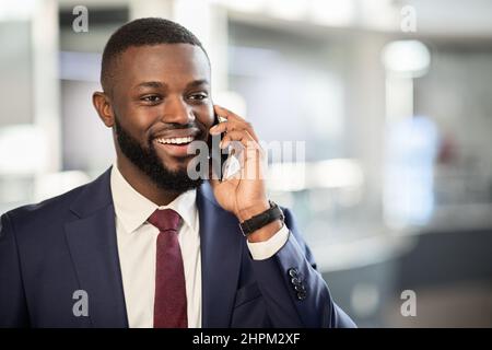 African american entrepreneur having phone conversation, closeup photo Stock Photo