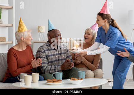Elderly black man having birthday party at nursing home Stock Photo