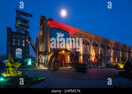 Germany, Bottrop, Ruhr area, Westphalia, North Rhine-Westphalia, NRW, Route of Industrial Heritage, hard coal mining industry, coalmine Prosper-Haniel, shaft tower Prosper II, Malakoff tower with headframe and former pithead bath, nowadays FLORIA adventure factory and catering trade, night photograph Stock Photo