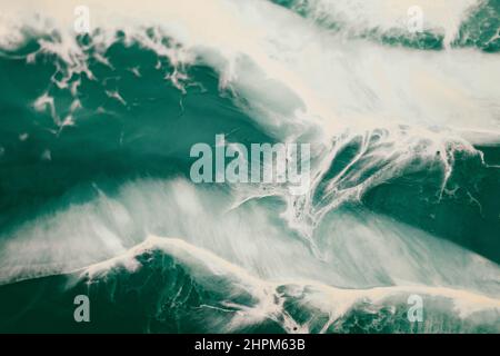 Green and white abstract marble texture like ocean foamy waves. Acrylic fluid art Stock Photo