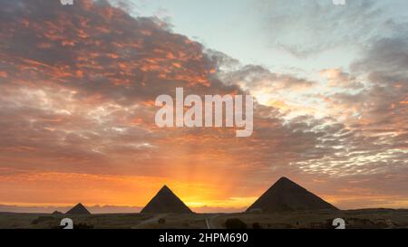 A view of the great pyramids of Egypt at sunset, Giza, Egypt. Stock Photo