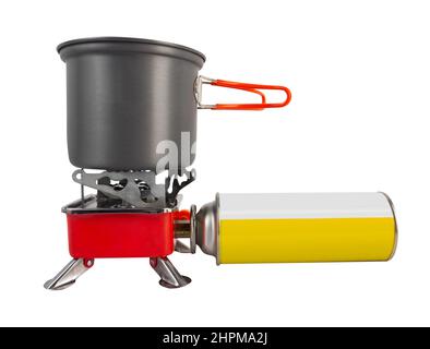 Isolated photo of metal camping gas stove with gas bottle and cup on white background. Stock Photo