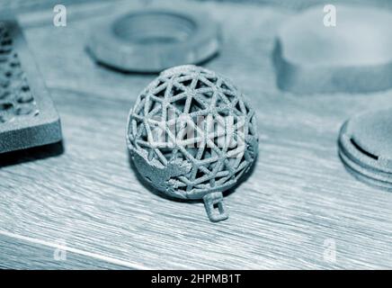 Gray abstract models printed on 3d printer from powder close-up. Stock Photo