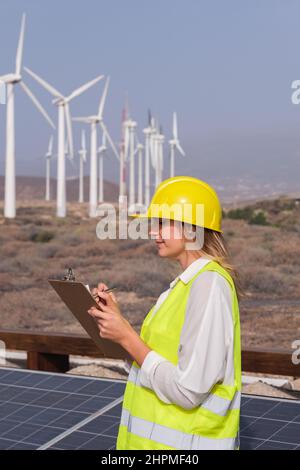 Female engineer doing windmill test run Stock Photo