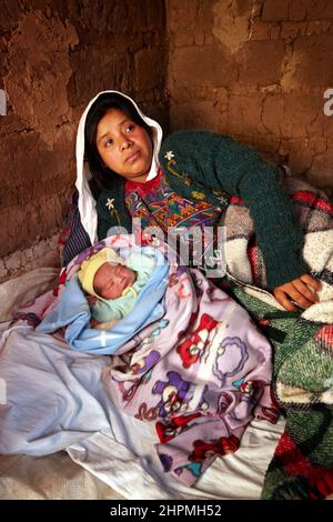 Midwife Ana María Chali visits Teresa and cared for her with the birth of their baby in Pachay in Guatemala. Stock Photo