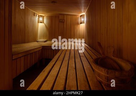 Bukovel, Ukraine February 4, 2022: bath in the Bukovel Hotel, steam treatments, wooden sunbeds and birch brooms. Stock Photo